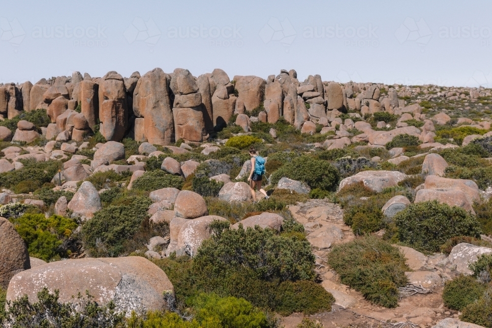 Young woman walking a bush trail - Australian Stock Image
