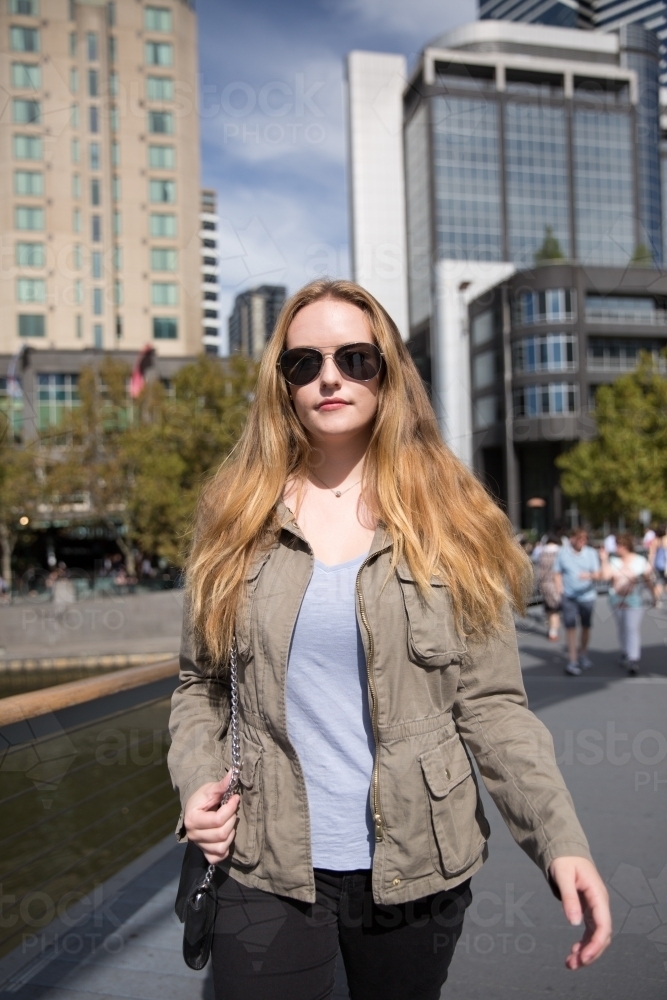 Young Woman Walking in Melbourne City - Australian Stock Image