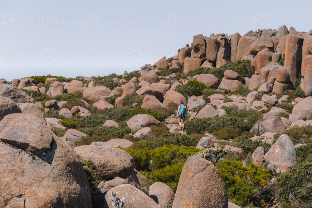 Young woman walking on a bush trail - Australian Stock Image