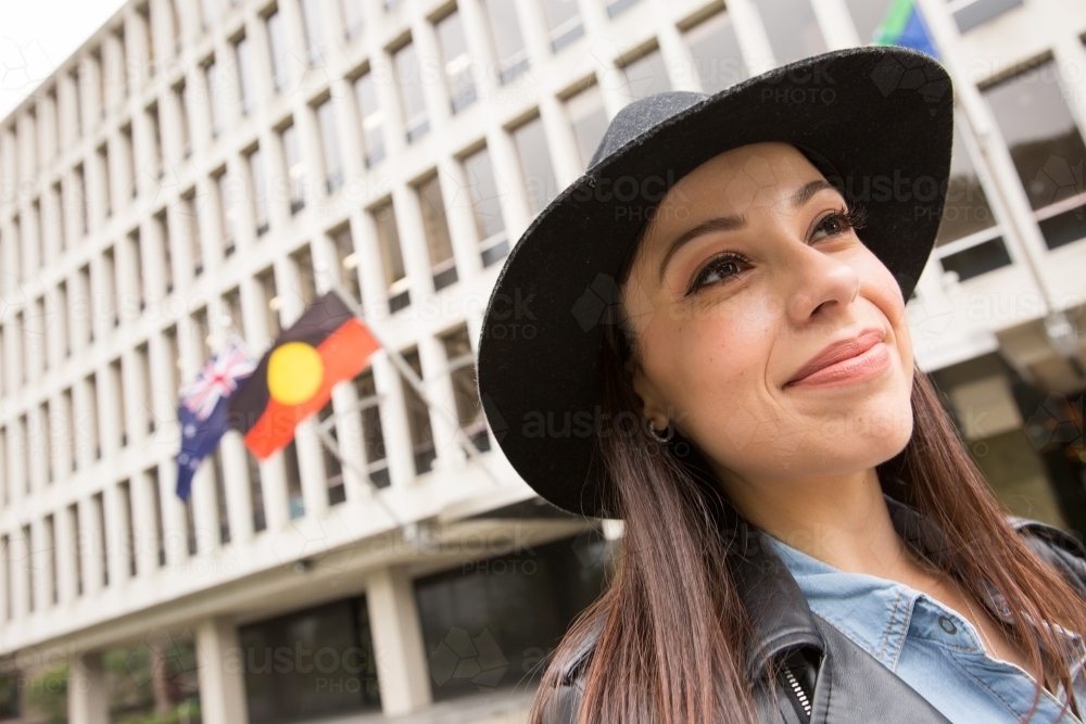Young Woman Walking Past Parliament - Australian Stock Image