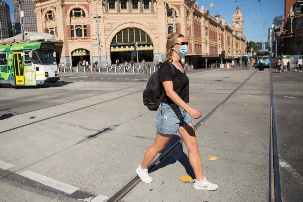 Young Woman Wearing Face Mask in Downtown Melbourne - Australian Stock Image