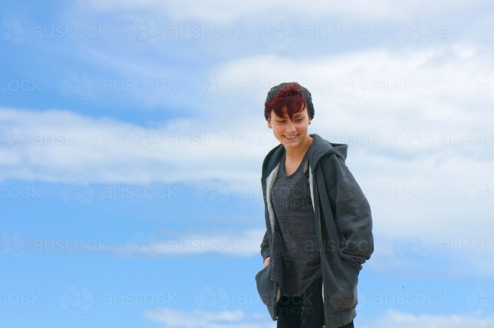 Young woman with red hair smiling - Australian Stock Image