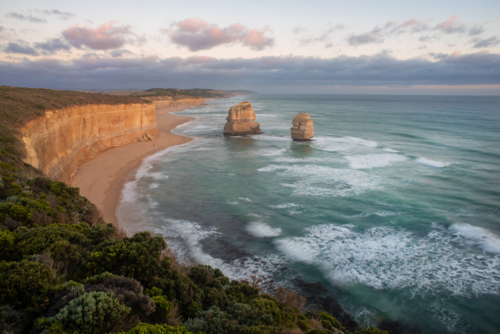 12 Apostles and Gibson Beach on the Port Campbell coast at sunset - Australian Stock Image