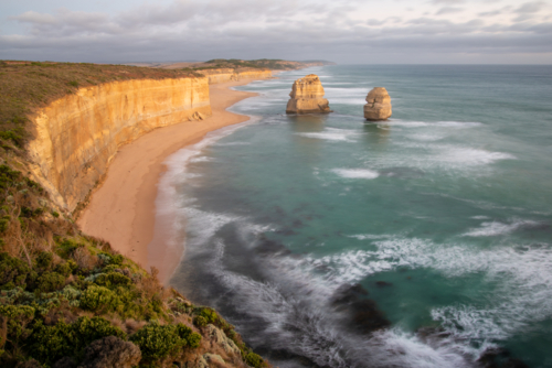 12 Apostles and Gibson Beach on the Port Campbell coast at sunset - Australian Stock Image