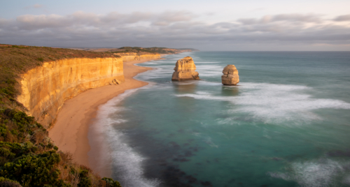 12 Apostles and Gibson Beach on the Port Campbell coast at sunset - Australian Stock Image
