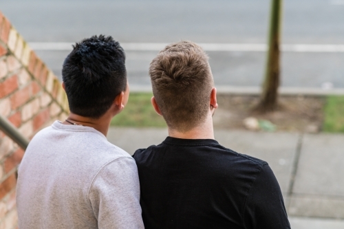 2 gay men, anonymous view from behind