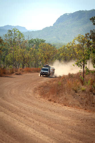 4 x 4 driving on dusty gravel road - Australian Stock Image