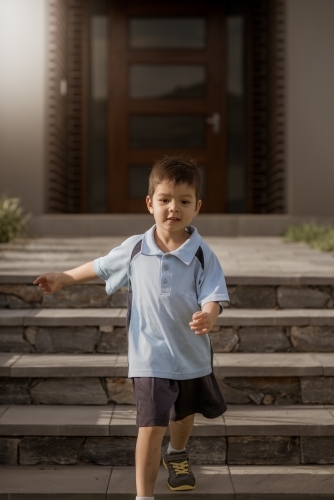 4 year old mixed race boy leaves home for his first day of preschool - Australian Stock Image