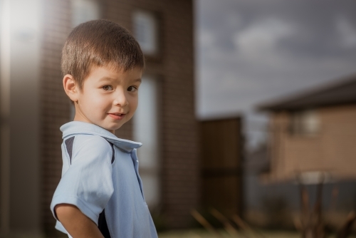 4 year old mixed race boy leaves home for his first day of preschool - Australian Stock Image