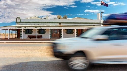 4wd passing the Birdsville Hotel - Australian Stock Image