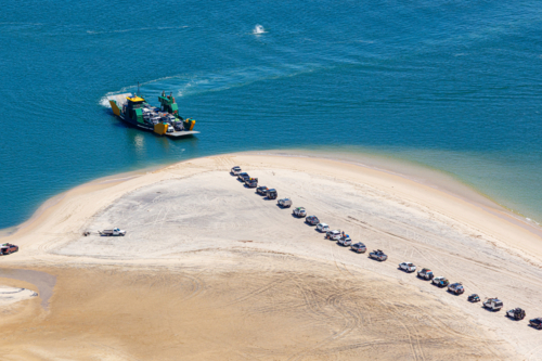 4wd vehicles waiting for ferry to K'Gari, Fraser Island - Australian Stock Image