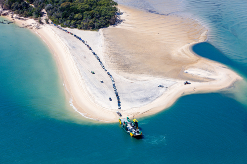 4wd vehicles waiting for ferry to K'Gari, Fraser Island - Australian Stock Image