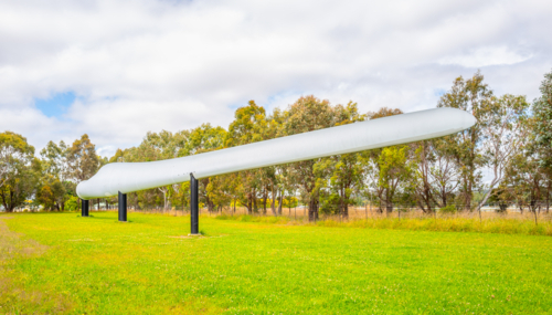 A 60 metre long broken blade from the White Rock wind farm has been installed as an attraction - Australian Stock Image