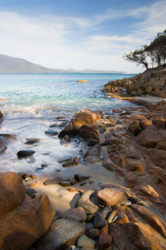 A beach in a remote part of the Freycinet Peninsula in Tasmania - Australian Stock Image