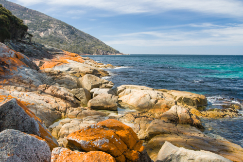 A beach in a remote part of the Freycinet Peninsula in Tasmania, Australia - Australian Stock Image