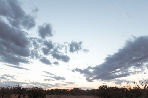 A big sky with scattered clouds above outback landscape - Australian Stock Image