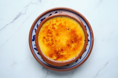 A bowl of crème brûlée - Australian Stock Image