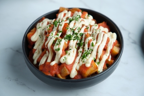 A bowl of patatas bravas - Australian Stock Image