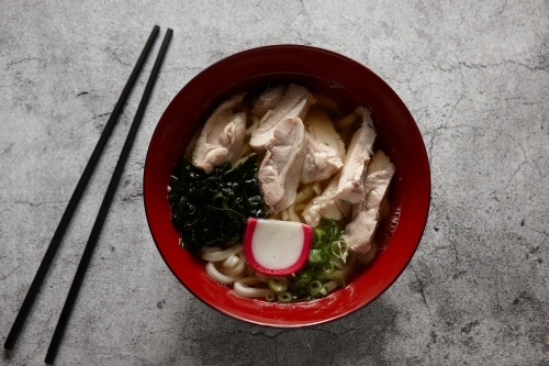 A bowl of ramen with chopsticks - Australian Stock Image