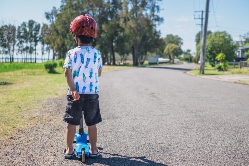 a boy with his scooter, exploring - Australian Stock Image