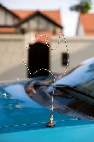 A car antenna made out of a coat hanger and shaped like a map of Australia - Australian Stock Image