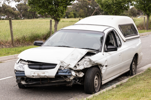 a car which has been badly smashed after a car accident - Australian Stock Image