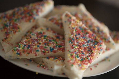 a Close up plate of fairy bread, bread buttered and then sprinkled with sprinkles - Australian Stock Image