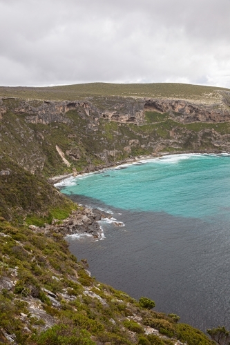 A coastal cliff overlooking the turquoise water - Australian Stock Image