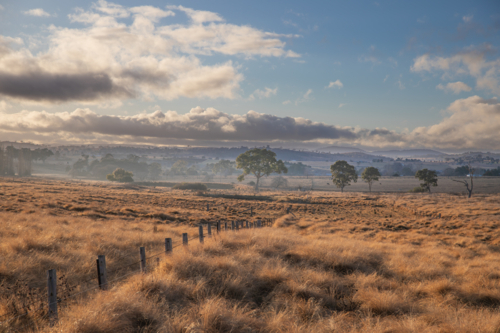 A country scene under a cloudy sky - Australian Stock Image