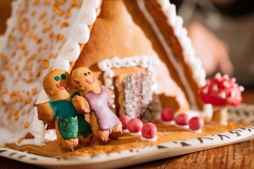 A decorated homemade gingerbread house with figurines - Australian Stock Image