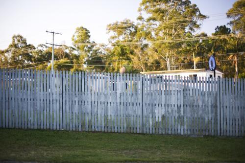 A fence between neighbours in suburbia.