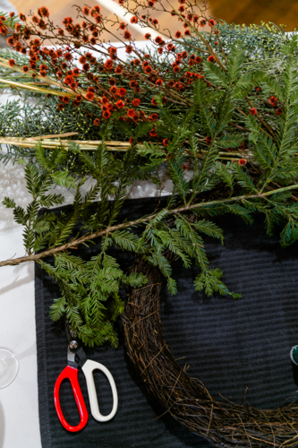 A flat lay of Christmas wreath supplies - Australian Stock Image
