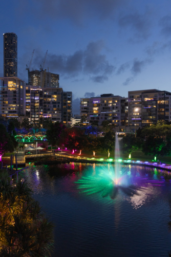 A fountain is lit up at night during an event at the Roma Street Parklands in Brisbane. - Australian Stock Image