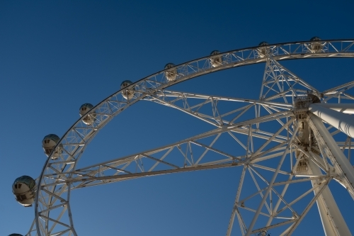 A generic large ferris wheel with gondolas to enjoy the view - Australian Stock Image