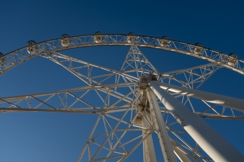 A generic large ferris wheel with gondolas to enjoy the view - Australian Stock Image