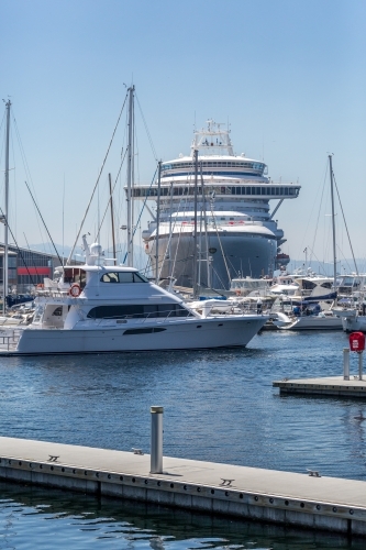 A giant cruise ship alongside Mac 2 and Kings Pier in Hobart. - Australian Stock Image