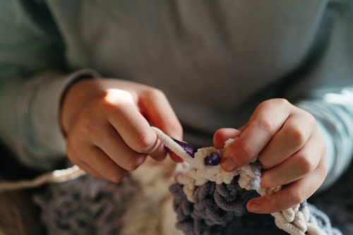 A girls hands crocheting - Australian Stock Image