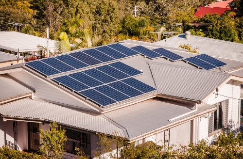 A House with Solar Panels on the Roof - Australian Stock Image