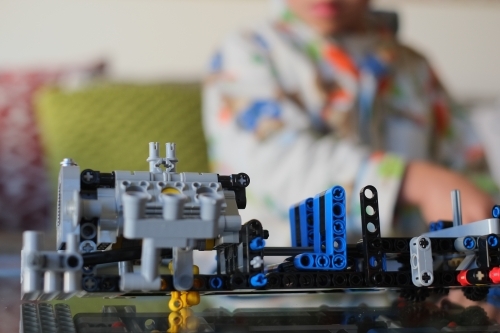 a kid building a Lego piece - Australian Stock Image