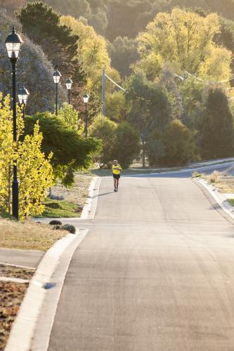 A man running up a residential street