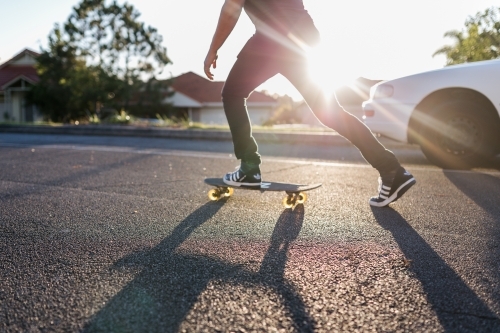 A man skating down the street - Australian Stock Image