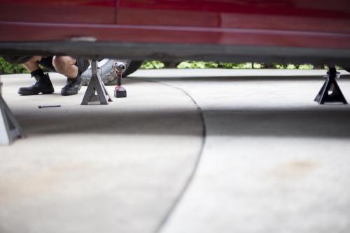 A mechanic services a vehicle. - Australian Stock Image