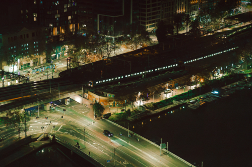 A moody nighttime cityscape along the coast. - Australian Stock Image