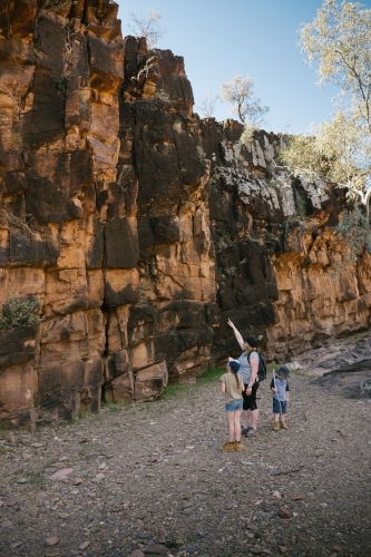 A mother and two kids trekking through the Flinders Ranges - Australian Stock Image