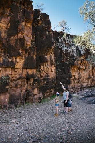 A mother and two kids trekking through the Flinders Ranges - Australian Stock Image