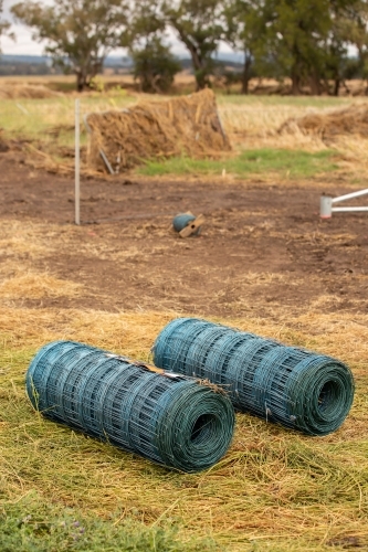 A new fence begins after a flood - Australian Stock Image