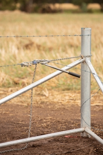 A new fence strainer being installed - Australian Stock Image