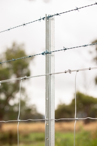 A new fence with barbed wire - Australian Stock Image