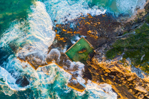 A overhead drone shot of North Curly rockpool after dawn - Australian Stock Image