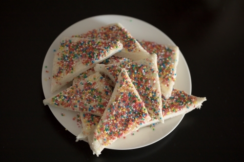 a plate of fairy bread, bread buttered and then sprinkled with sprinkles - Australian Stock Image